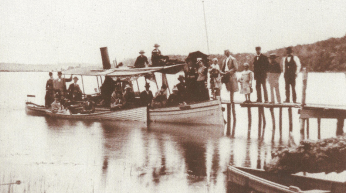 Old Photo from Lake Minnetonka of people getting into a boat.
